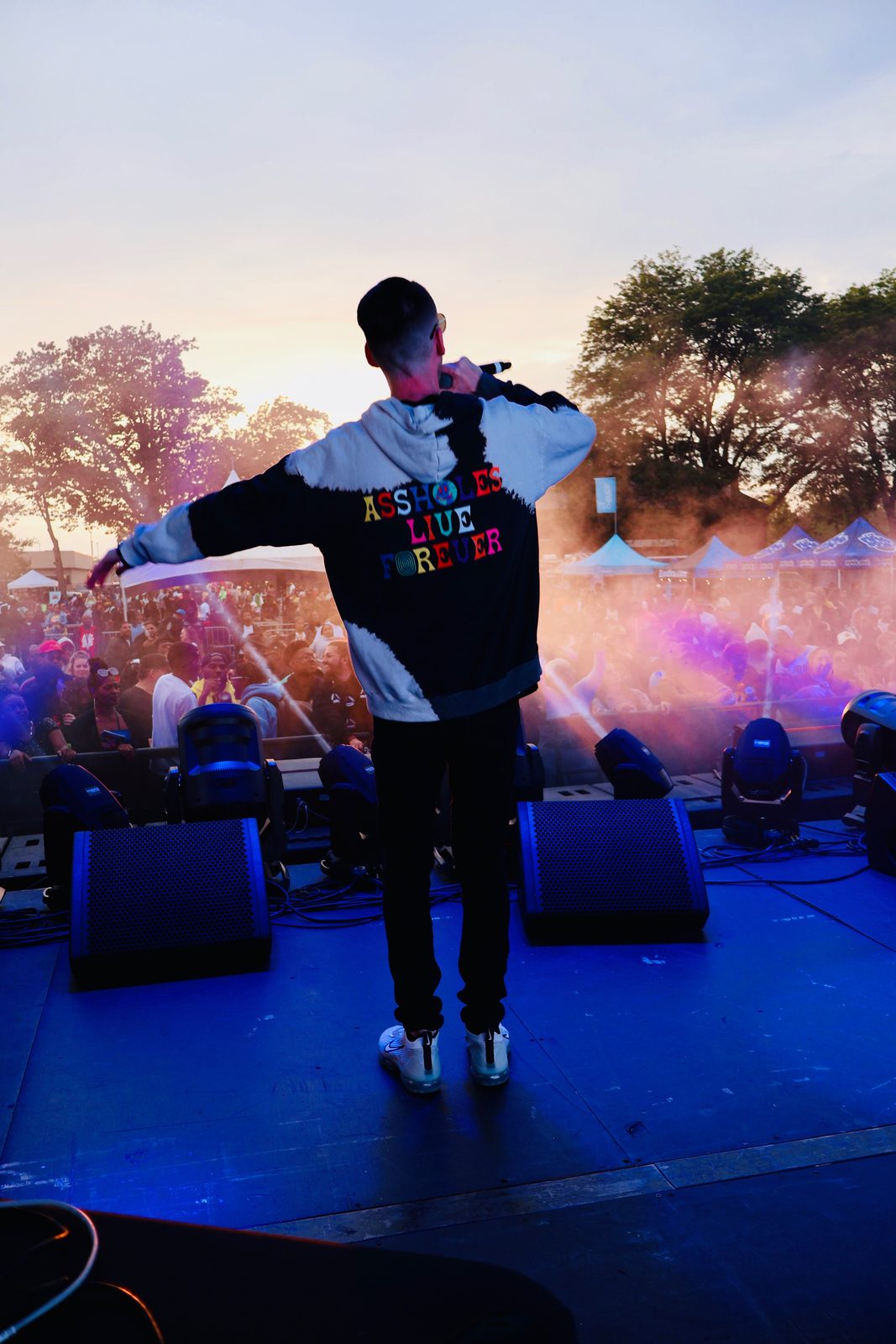 KING T performing on a smoky stage