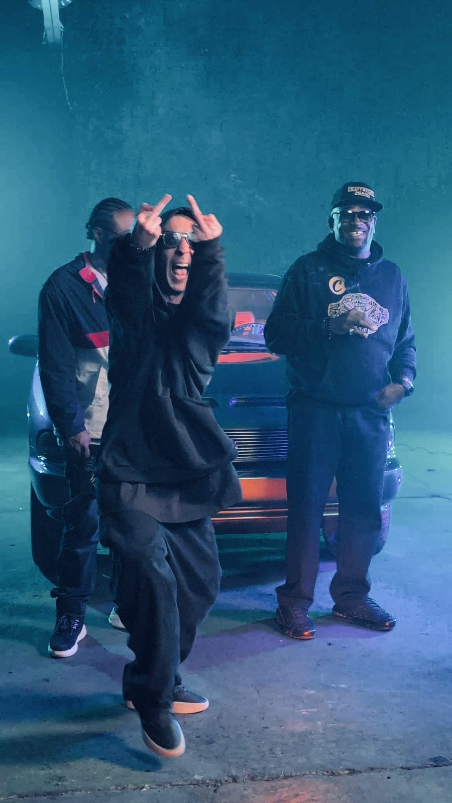 KING T on a music video set in blue light
